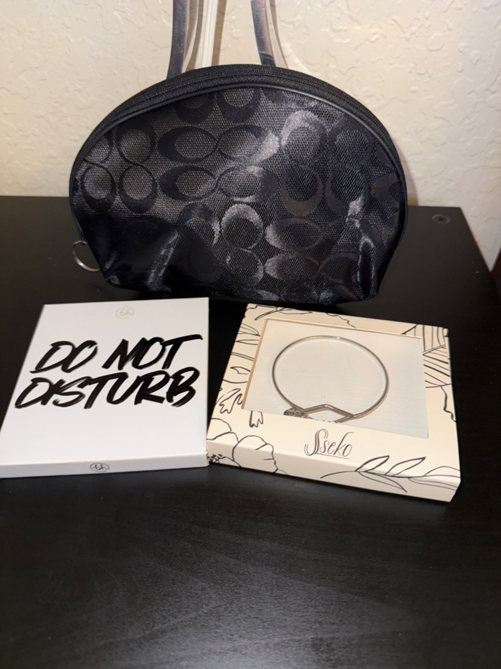 Do not Disturb Eye Shadow Palette, Sseko bracelet and black cosmetic bag